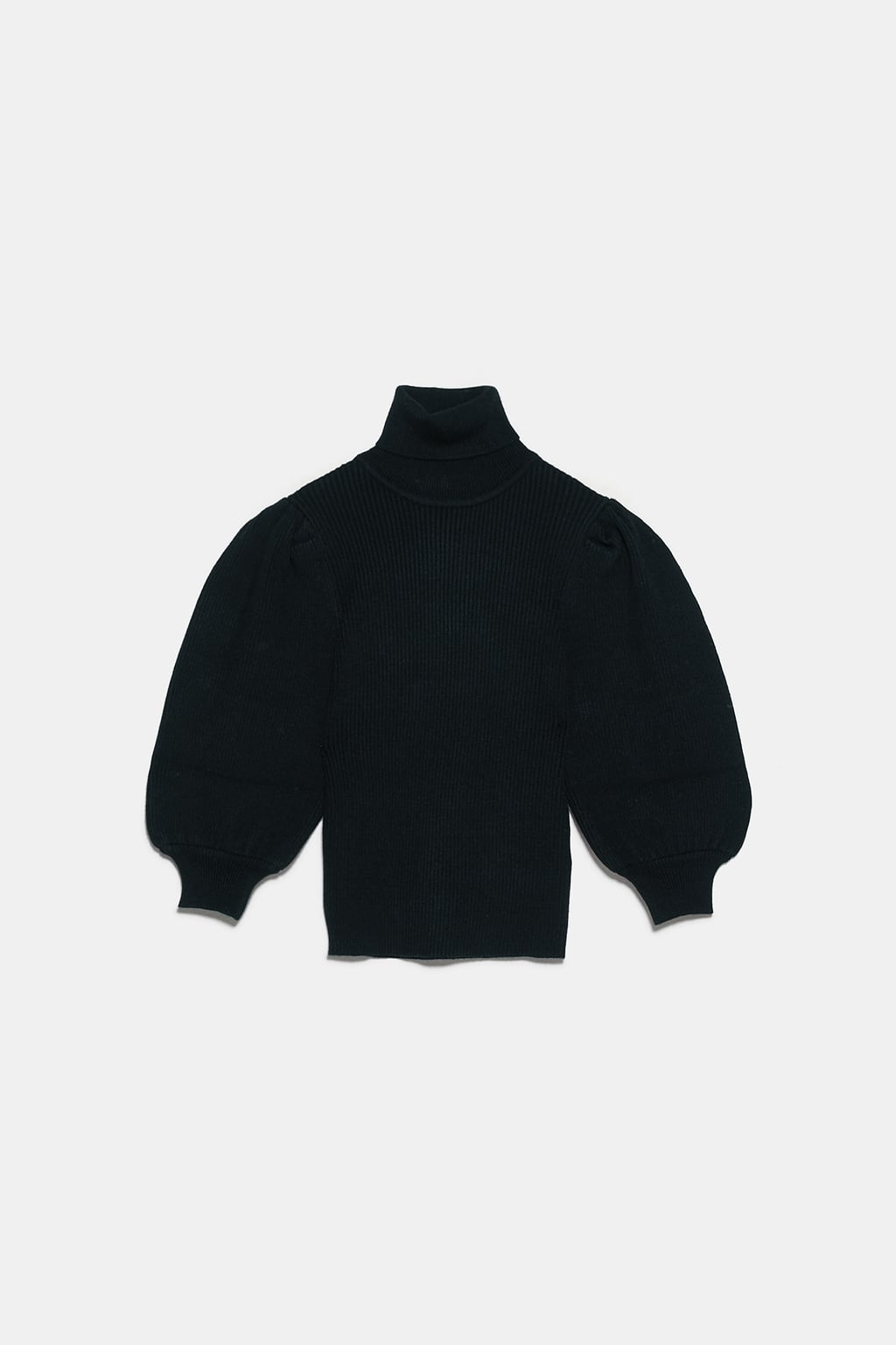 Пуловер Zara
Подарък, с който никога няма да сгрешим, е от рода на пуловерите. Онова, на което трябва да обърнем внимание, е различността на модела, в случая харесан заради високото поло, подпухналия буфан ръкав, структурирания торс, както и сбитата плетка в дълбок бургундски нюанс. 
Цена: 49,95 лв.